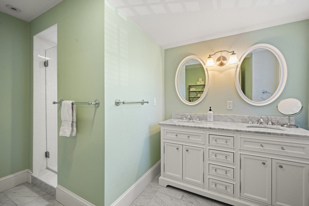 3 Mount Vernon Square, Unit 2 Boston, MA 02108 - Photo 29 of 33 a bathroom with a granite countertop toilet sink and mirror