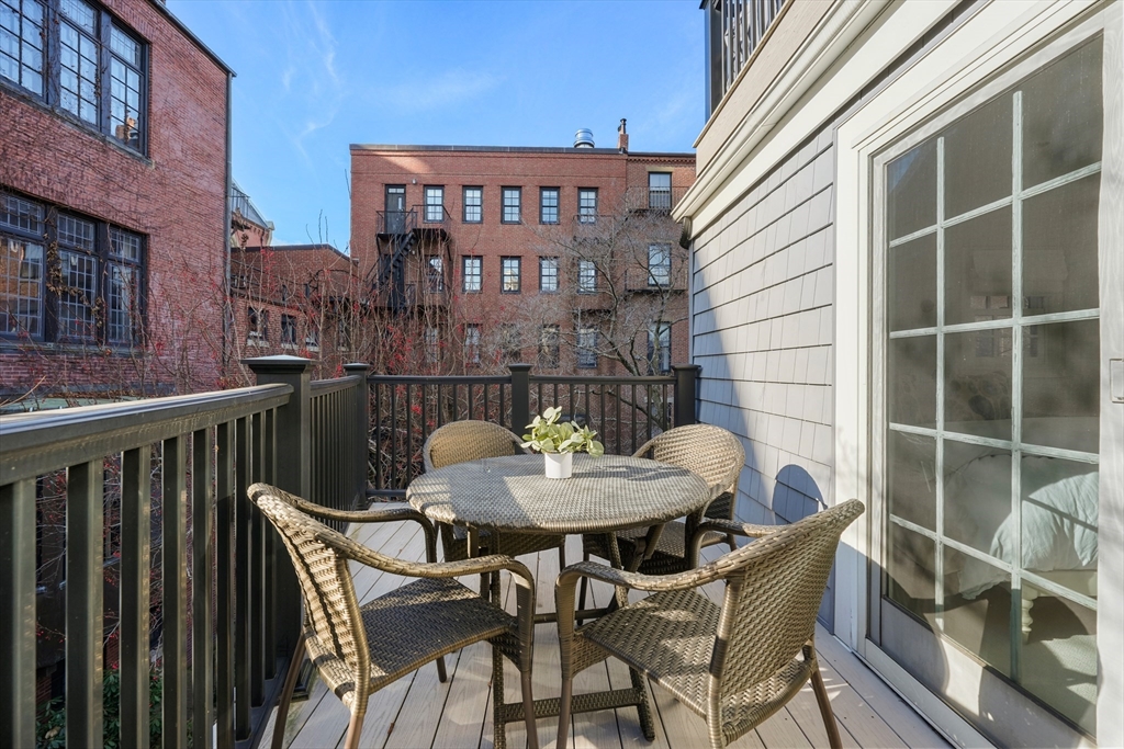 3 Mount Vernon Square, Unit 2 Boston, MA 02108 - Photo 30 of 33 a view of a balcony with table and chairs