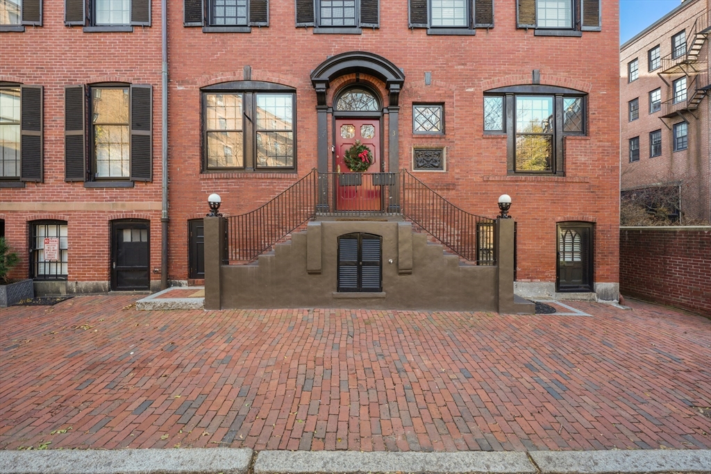 3 Mount Vernon Square, Unit 2 Boston, MA 02108 - Photo 32 of 33 a large building with a lot of windows