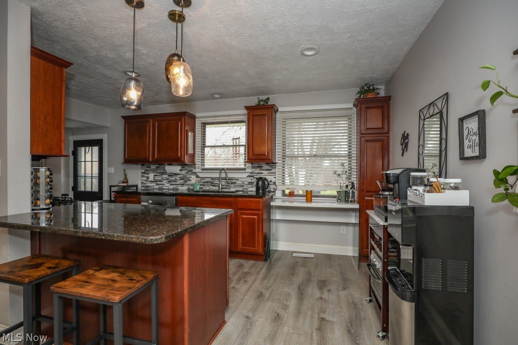 10676 Holcomb Road Newton Falls, OH 44444 - Photo 15 of 38 Kitchen featuring a kitchen bar, granite countertops