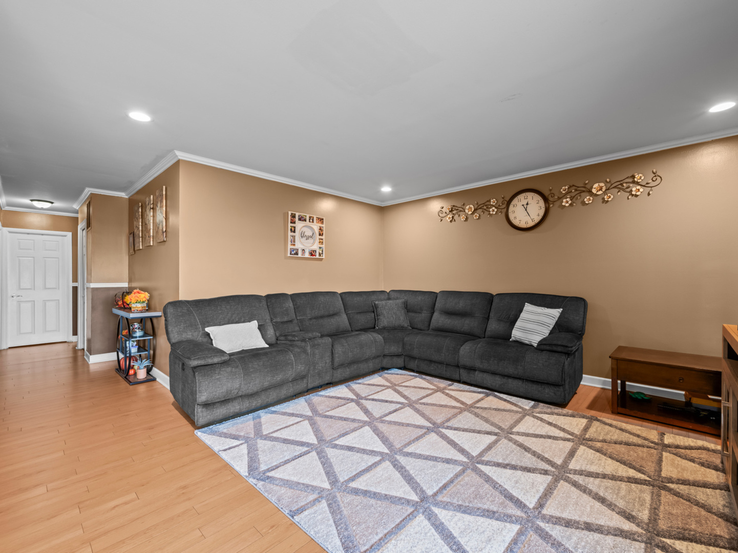 1905 Pierce Road Hoffman Estates, IL 60169 - Photo 11 of 27 a living room with a couch and a coffee table