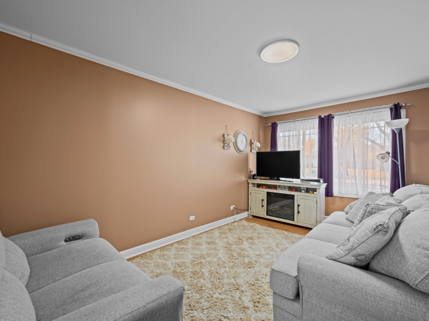 1905 Pierce Road Hoffman Estates, IL 60169 - Photo 20 of 27 a living room with furniture and a flat screen tv