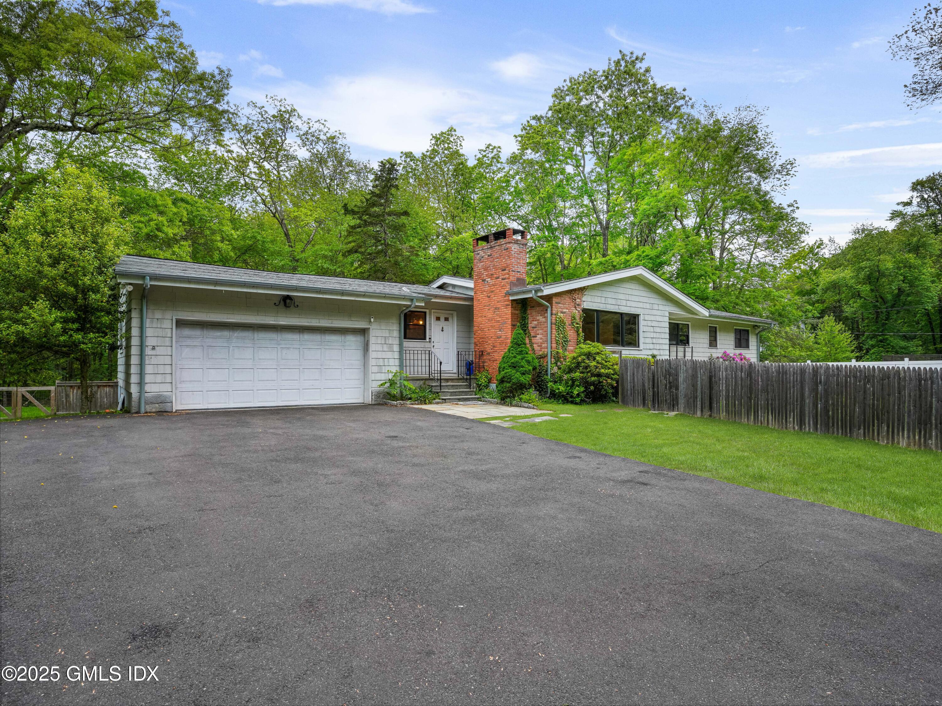 330 Cognewaugh Road Cos Cob, CT 06807 - Photo 22 of 24 driveway side entrance