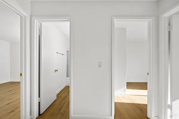 a view of a bathroom from a hallway