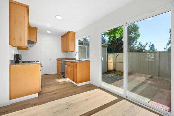 a bathroom with a tub mirror and window