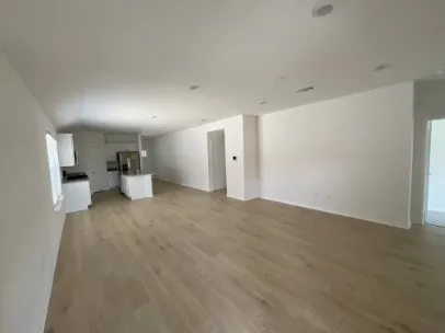 a view of an empty room and window