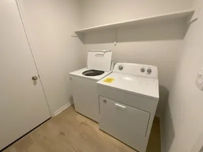 a view of a storage & utility room with a sink