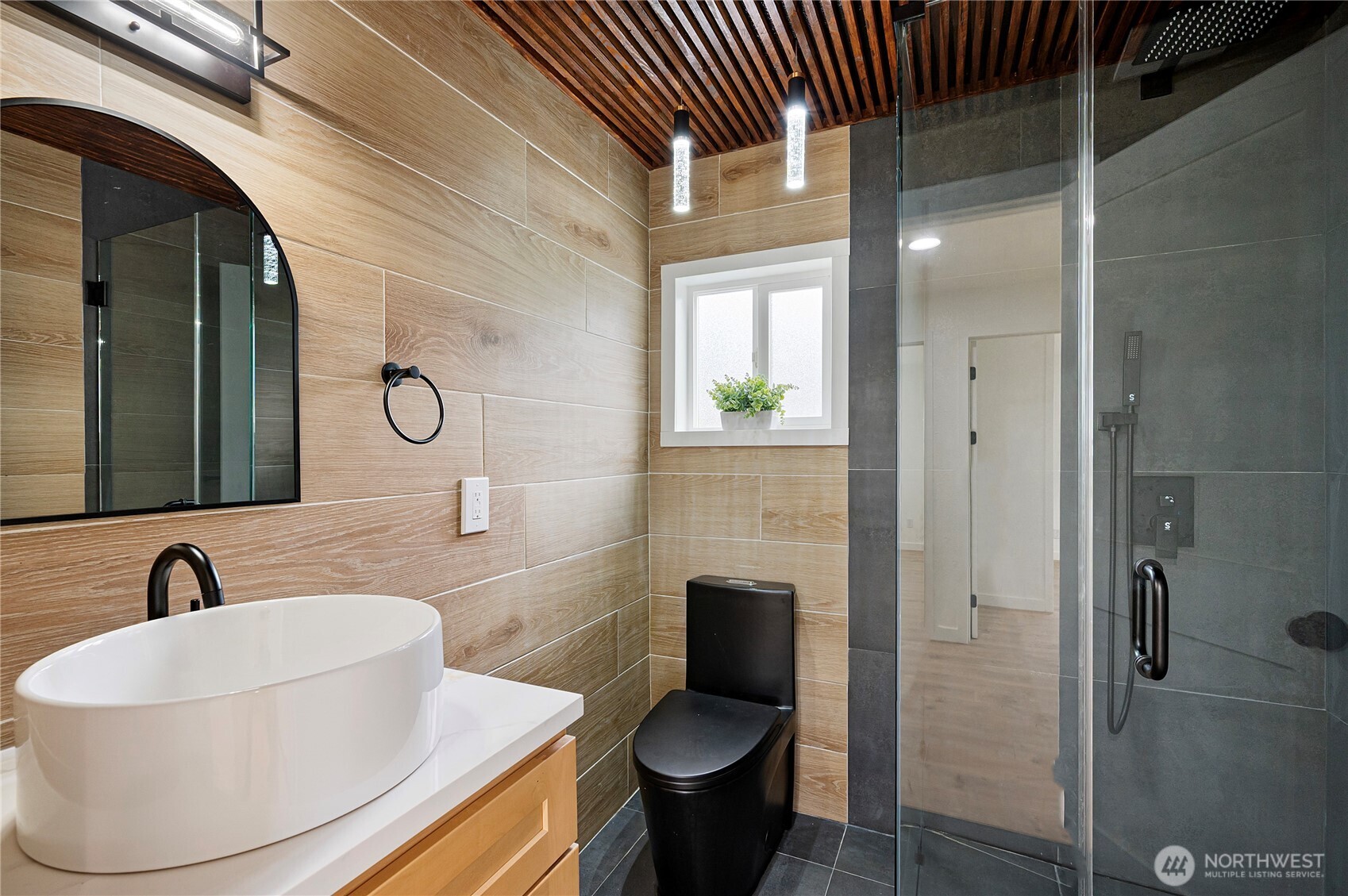 1406 Shattuck Avenue South Renton, WA 98055 - Photo 11 of 22 a bathroom with a sink and a mirror