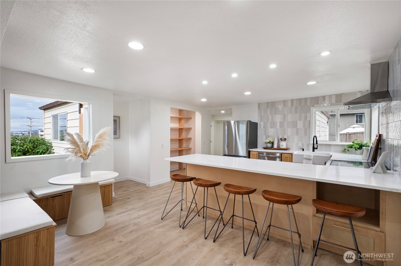 1406 Shattuck Avenue South Renton, WA 98055 - Photo 4 of 22 a kitchen with a table and chairs in it