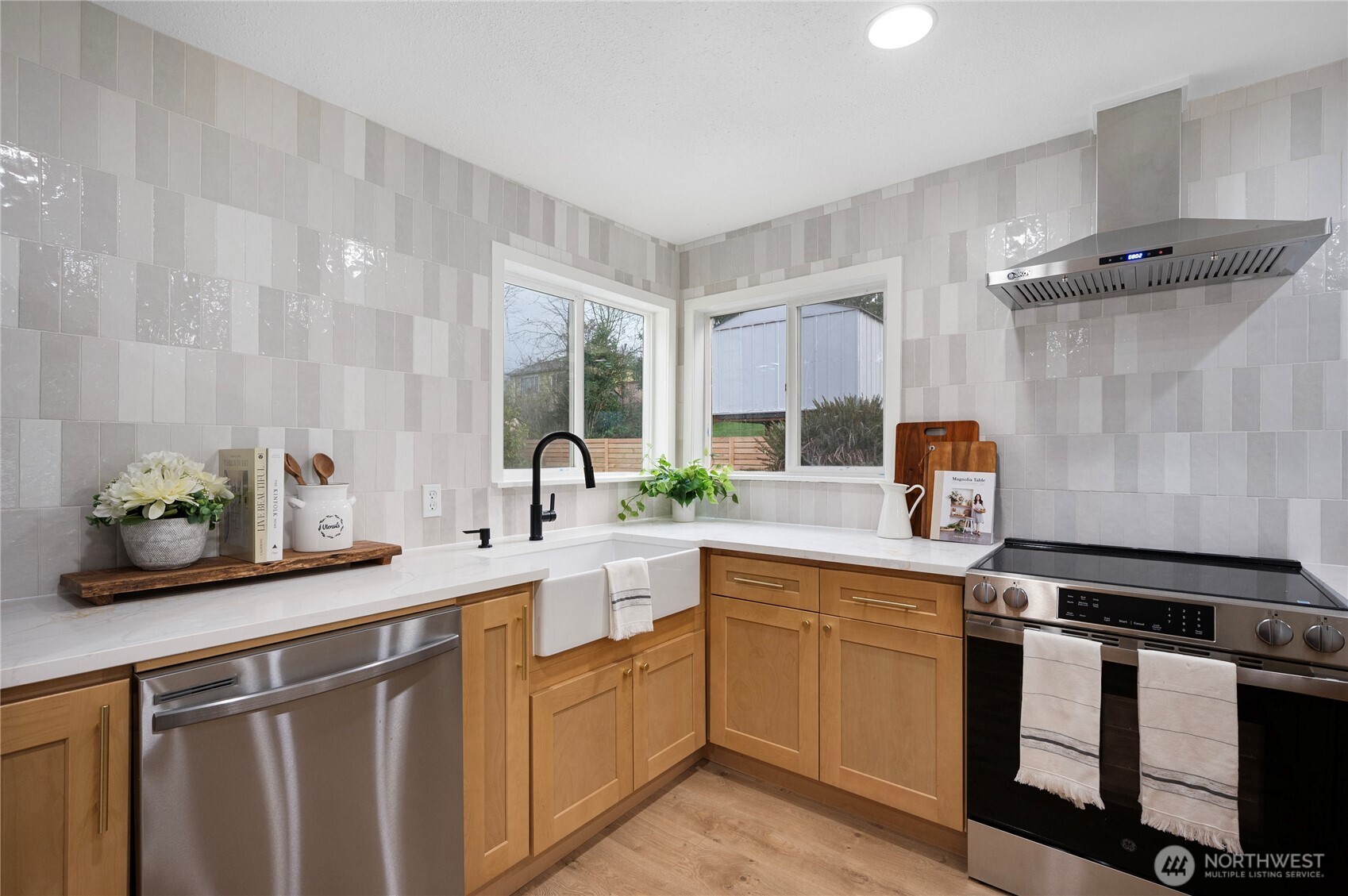 1406 Shattuck Avenue South Renton, WA 98055 - Photo 7 of 22 a kitchen with a sink and cabinets