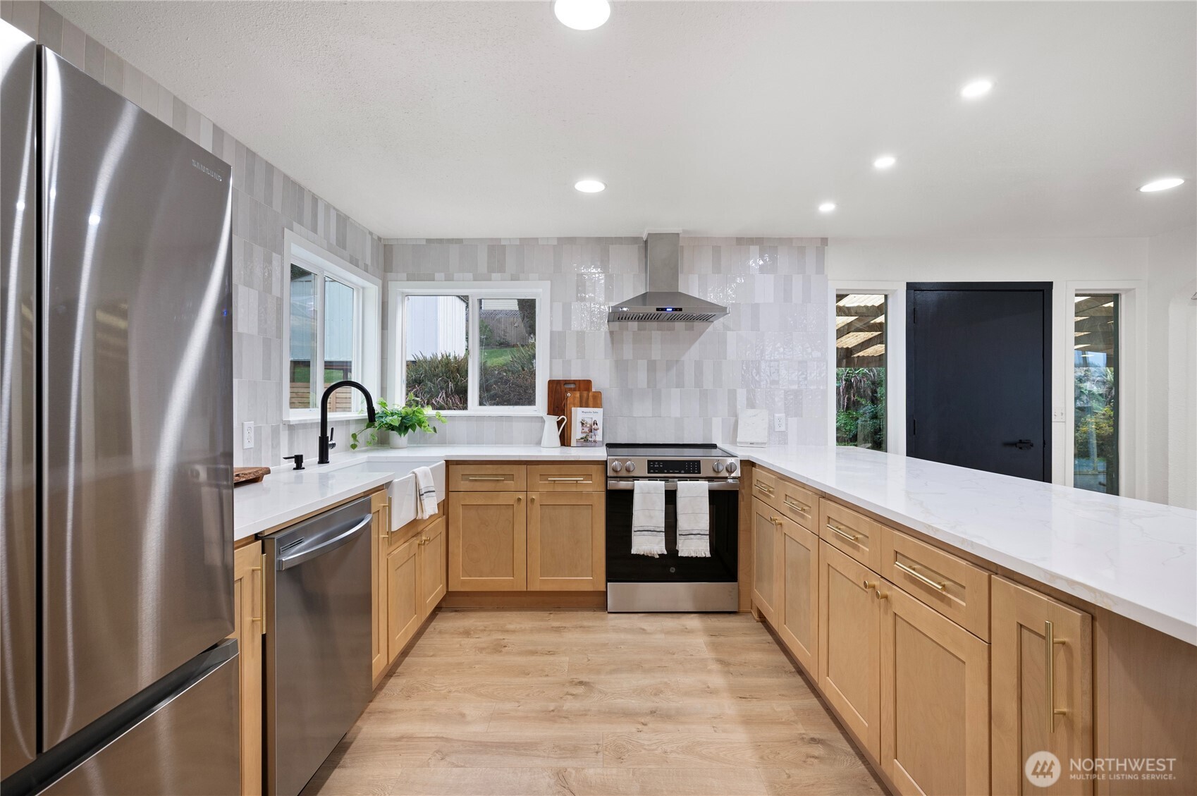 1406 Shattuck Avenue South Renton, WA 98055 - Photo 8 of 22 a large kitchen with stainless steel appliances lots of counter top space