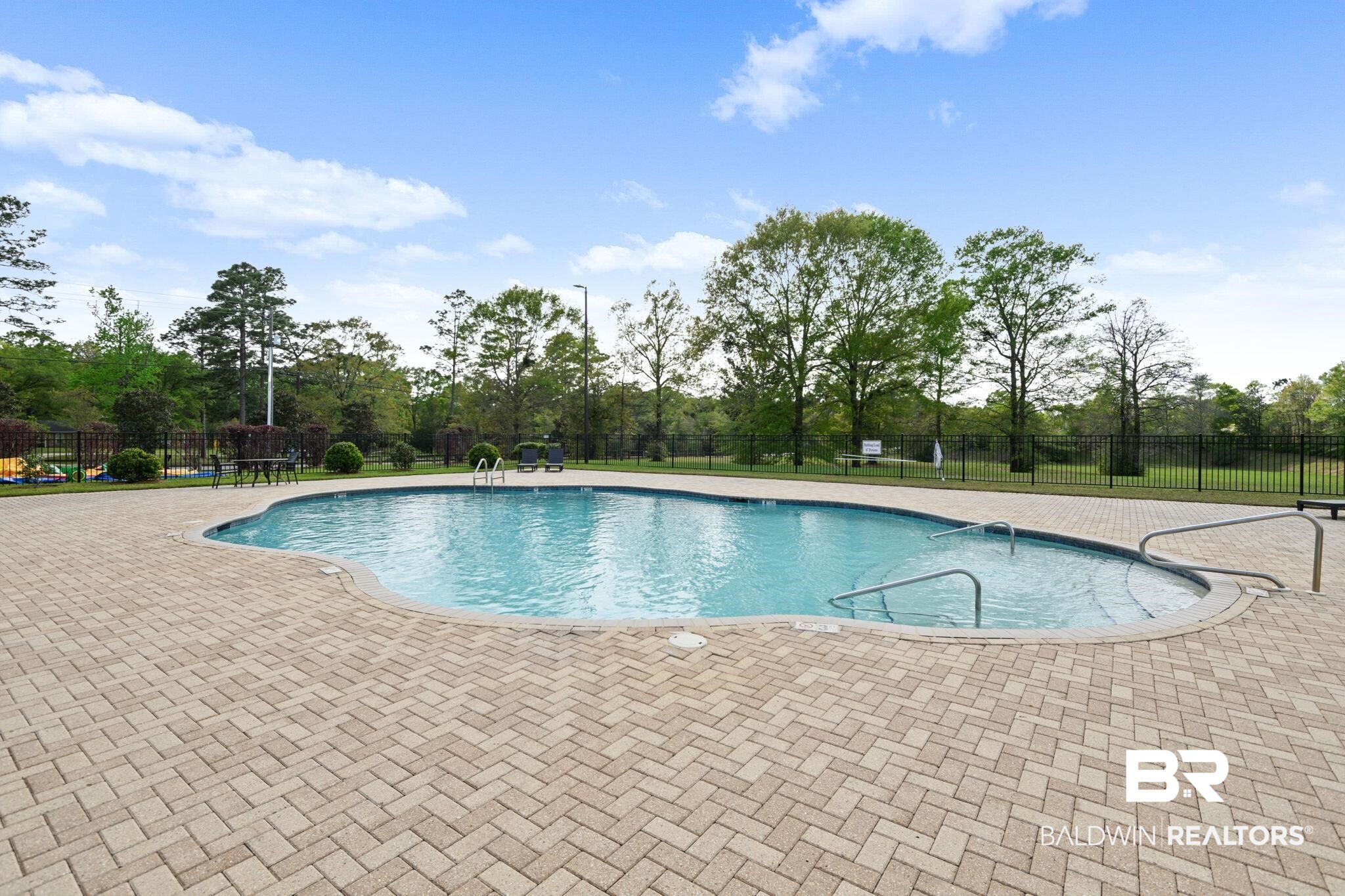 2183 Meadowview Loop Semmes, AL 36575 - Photo 49 of 58 Community pool featuring a patio area and view of scattered trees
