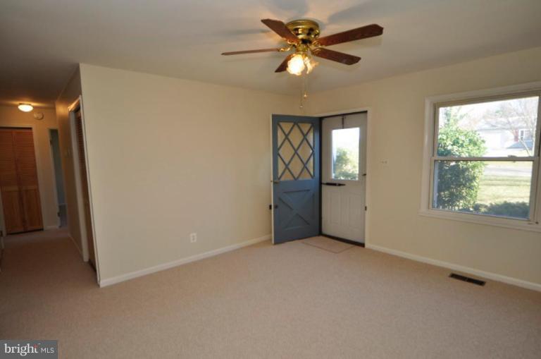 Light and Bright Living Room with Ceiling Fan