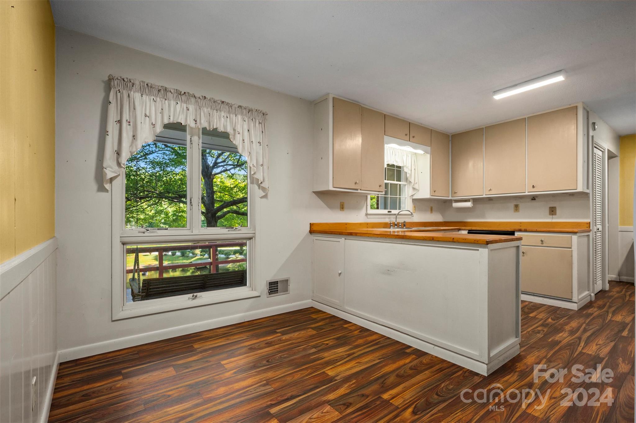 280 Dug Hill Road Landrum, SC 29356 - Photo 13 of 45 a kitchen with stainless steel appliances granite countertop a stove a refrigerator a sink and a microwave