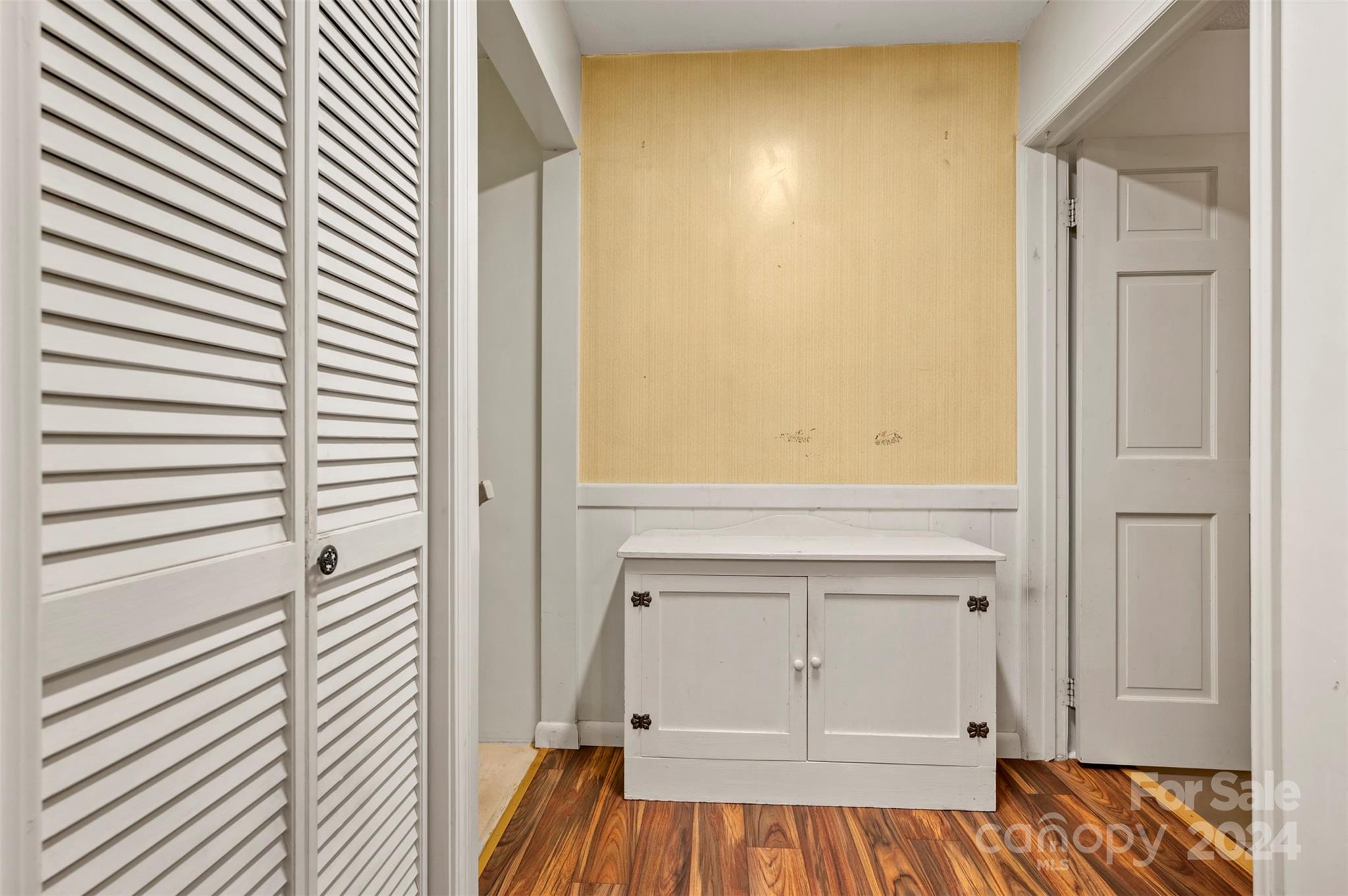 280 Dug Hill Road Landrum, SC 29356 - Photo 16 of 45 a view of a bedroom with wooden floor and cabinet