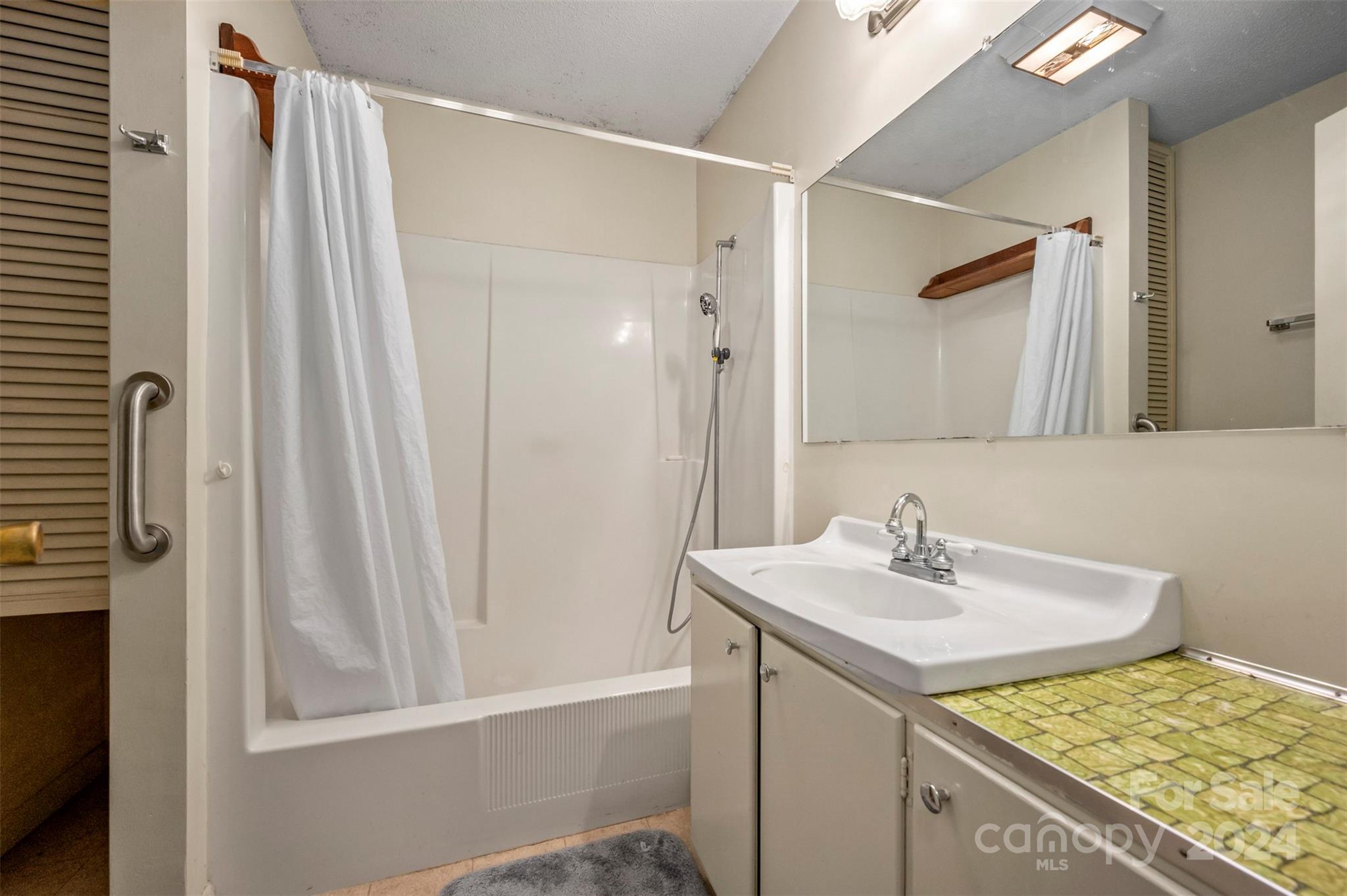 280 Dug Hill Road Landrum, SC 29356 - Photo 18 of 45 a bathroom with a sink and a mirror