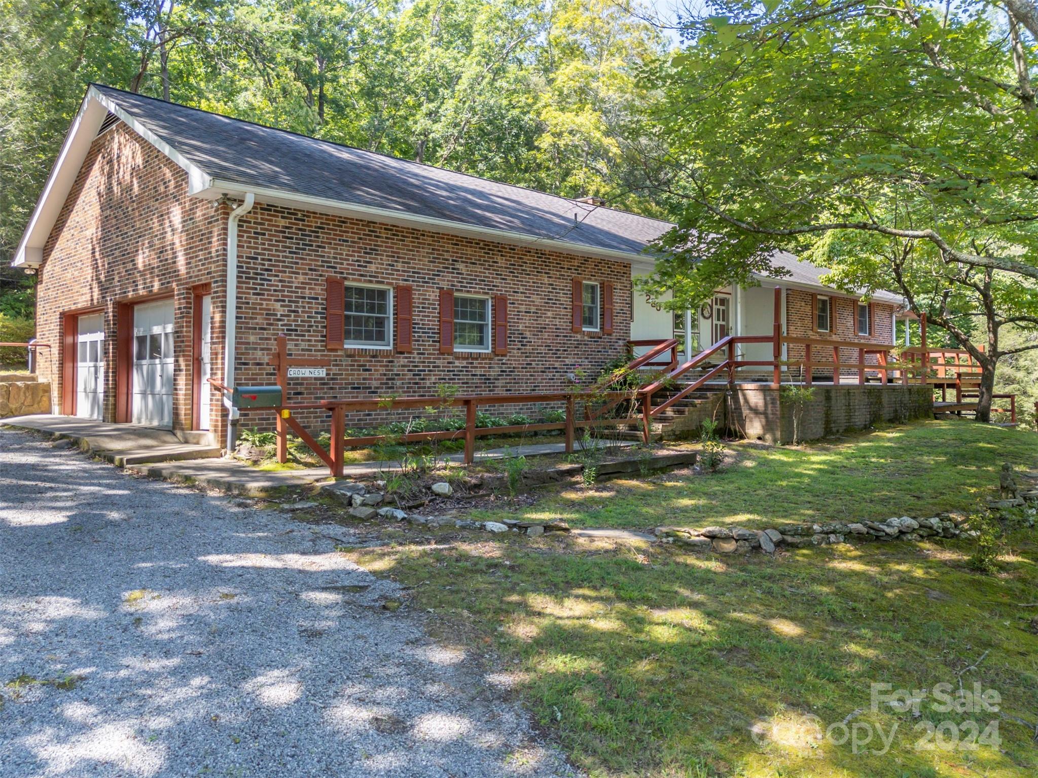 280 Dug Hill Road Landrum, SC 29356 - Photo 2 of 45 a view of a house with backyard