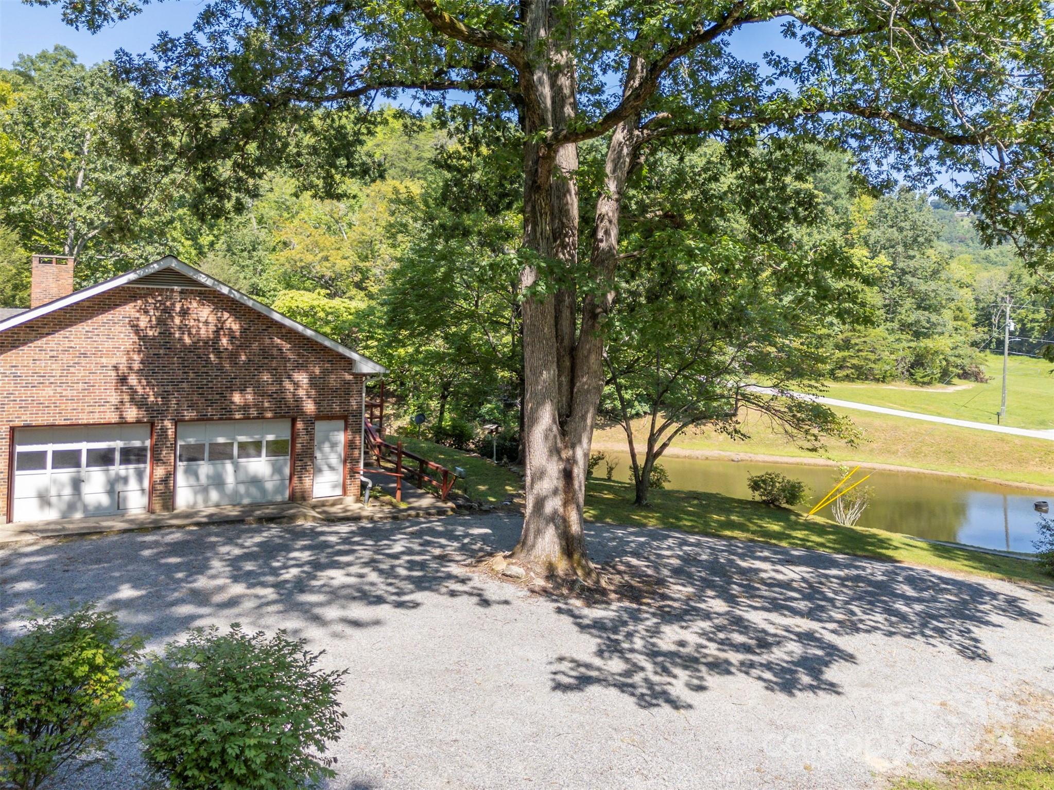280 Dug Hill Road Landrum, SC 29356 - Photo 35 of 45 a view of a house with a yard