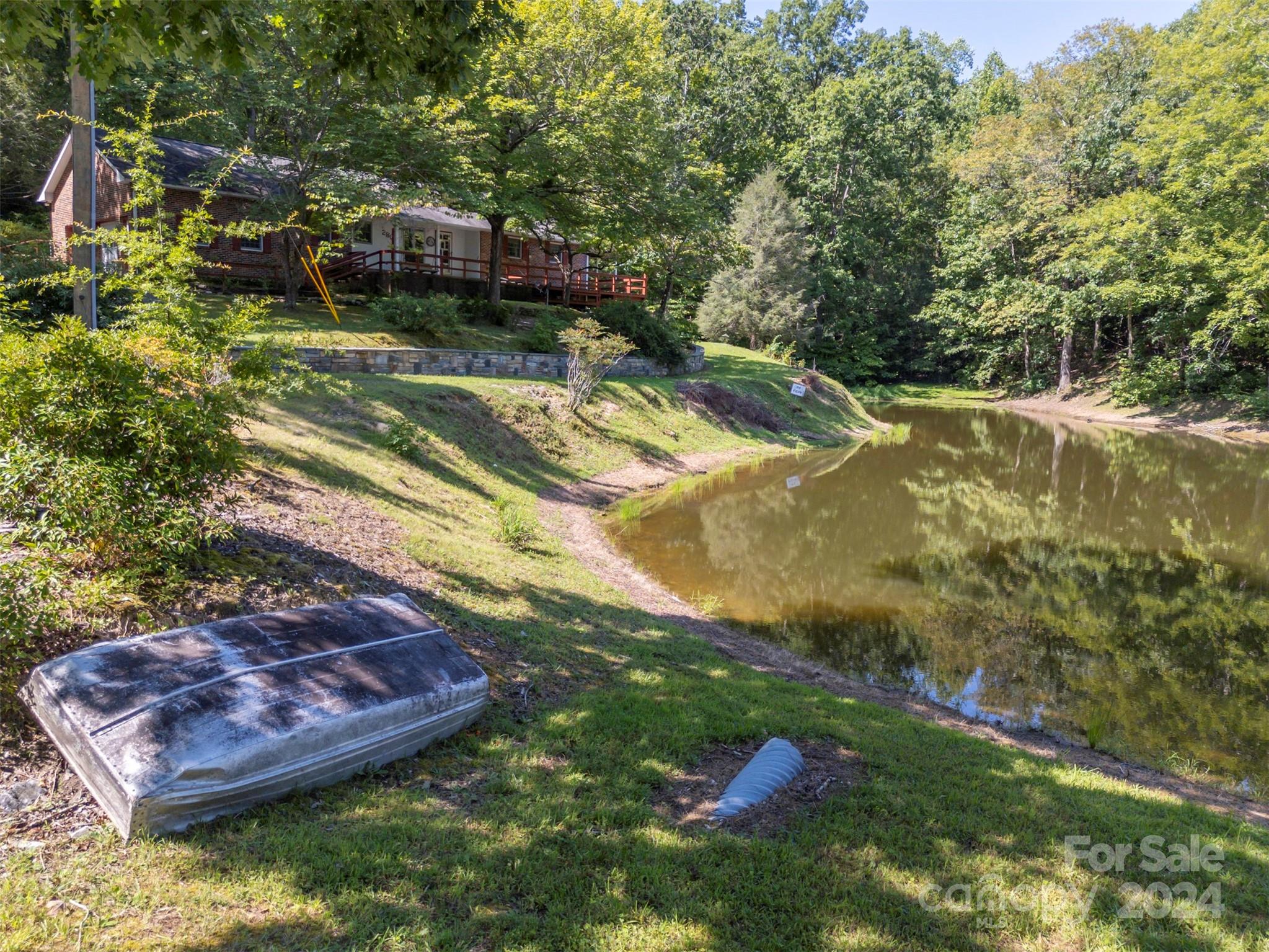 280 Dug Hill Road Landrum, SC 29356 - Photo 39 of 45 a view of a backyard with swimming pool