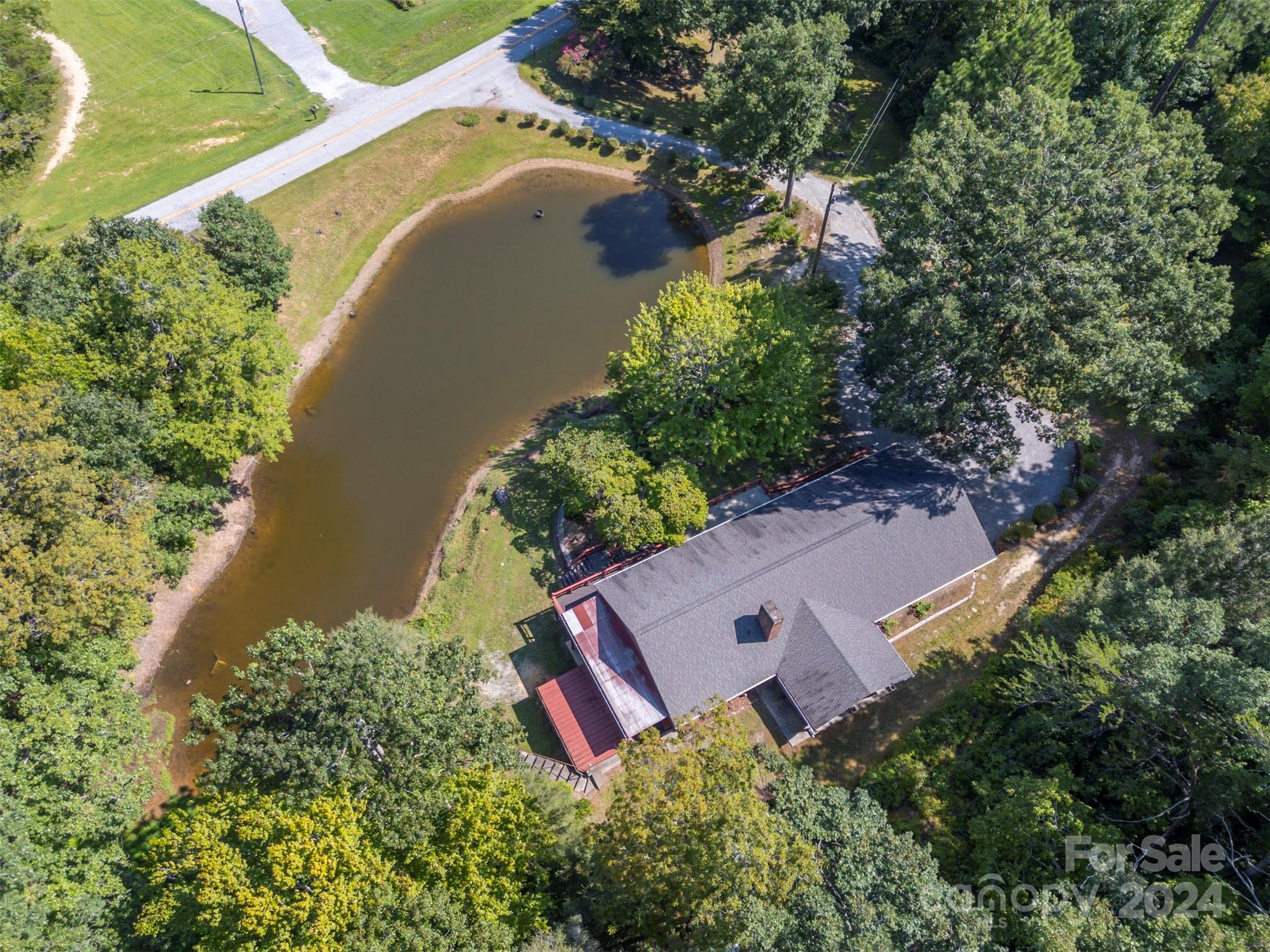 280 Dug Hill Road Landrum, SC 29356 - Photo 41 of 45 an aerial view of a house with a yard and lake view