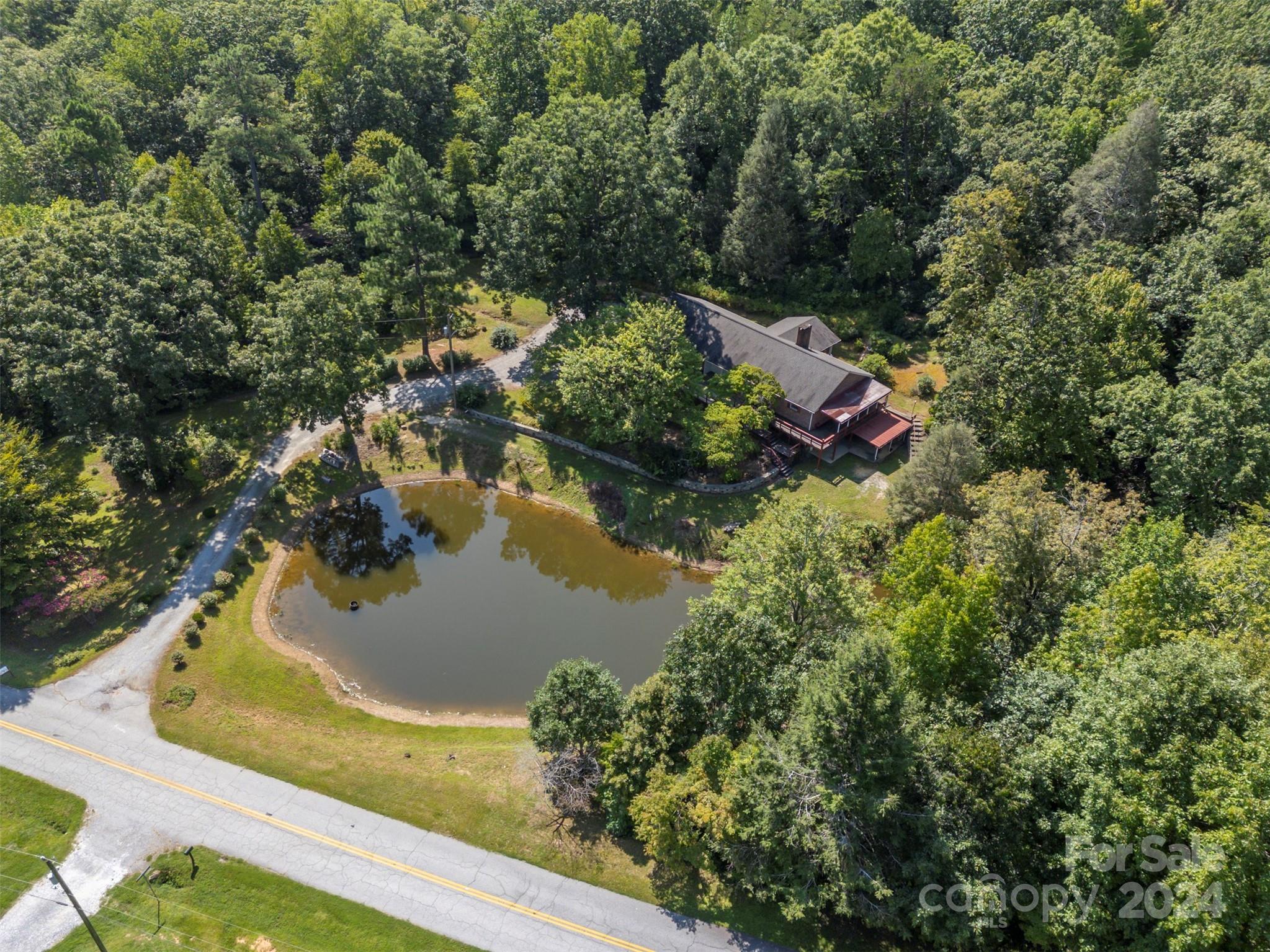 280 Dug Hill Road Landrum, SC 29356 - Photo 42 of 45 a view of a lake with houses