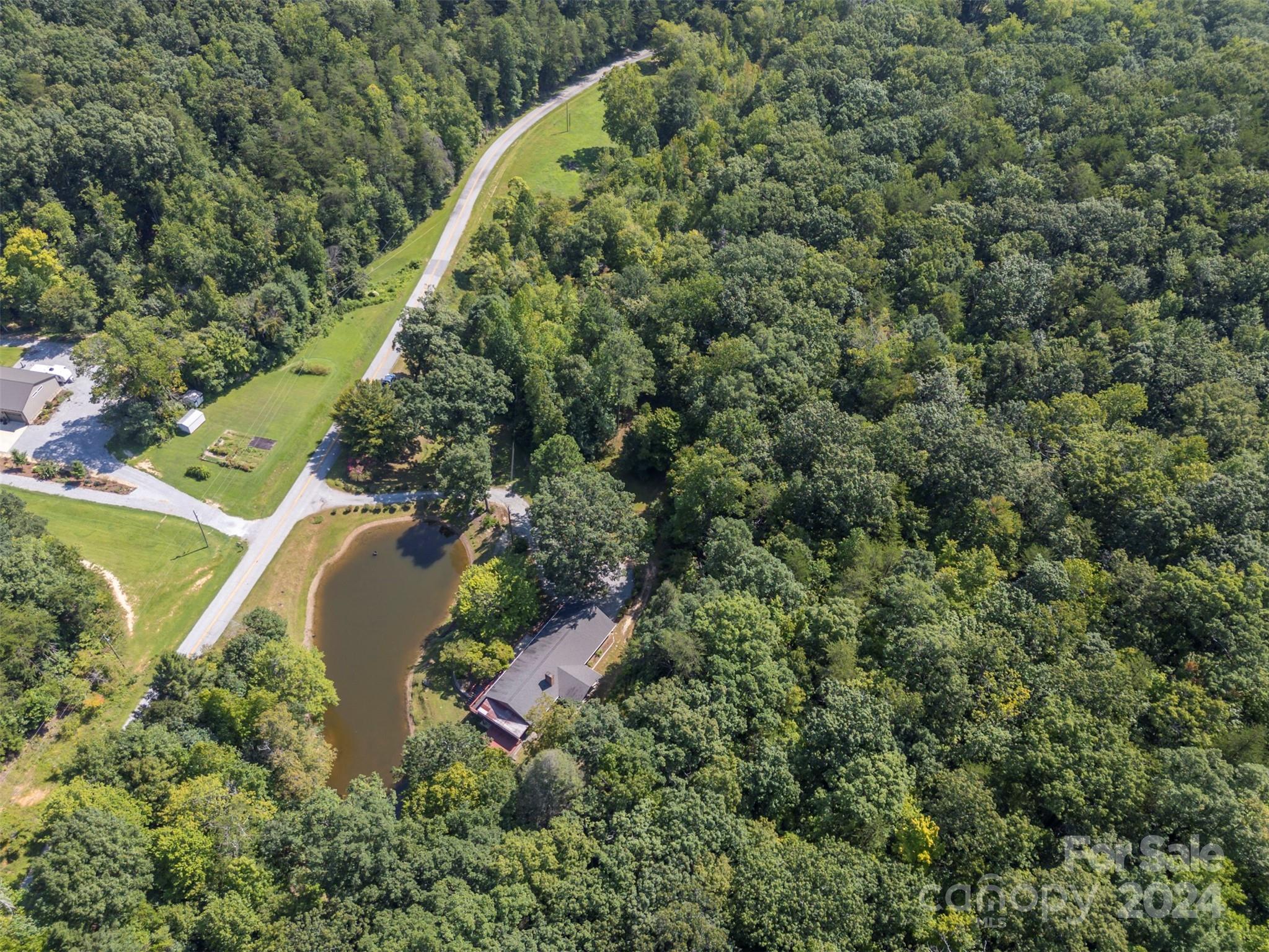 280 Dug Hill Road Landrum, SC 29356 - Photo 43 of 45 an aerial view of residential house with outdoor space and trees all around