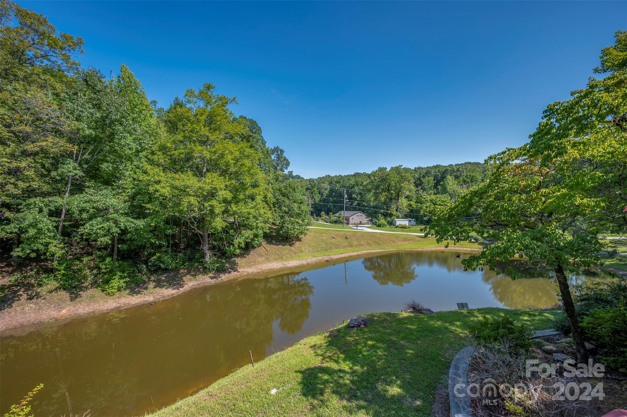 280 Dug Hill Road Landrum, SC 29356 - Photo 6 of 45 a view of a lake with outdoor space