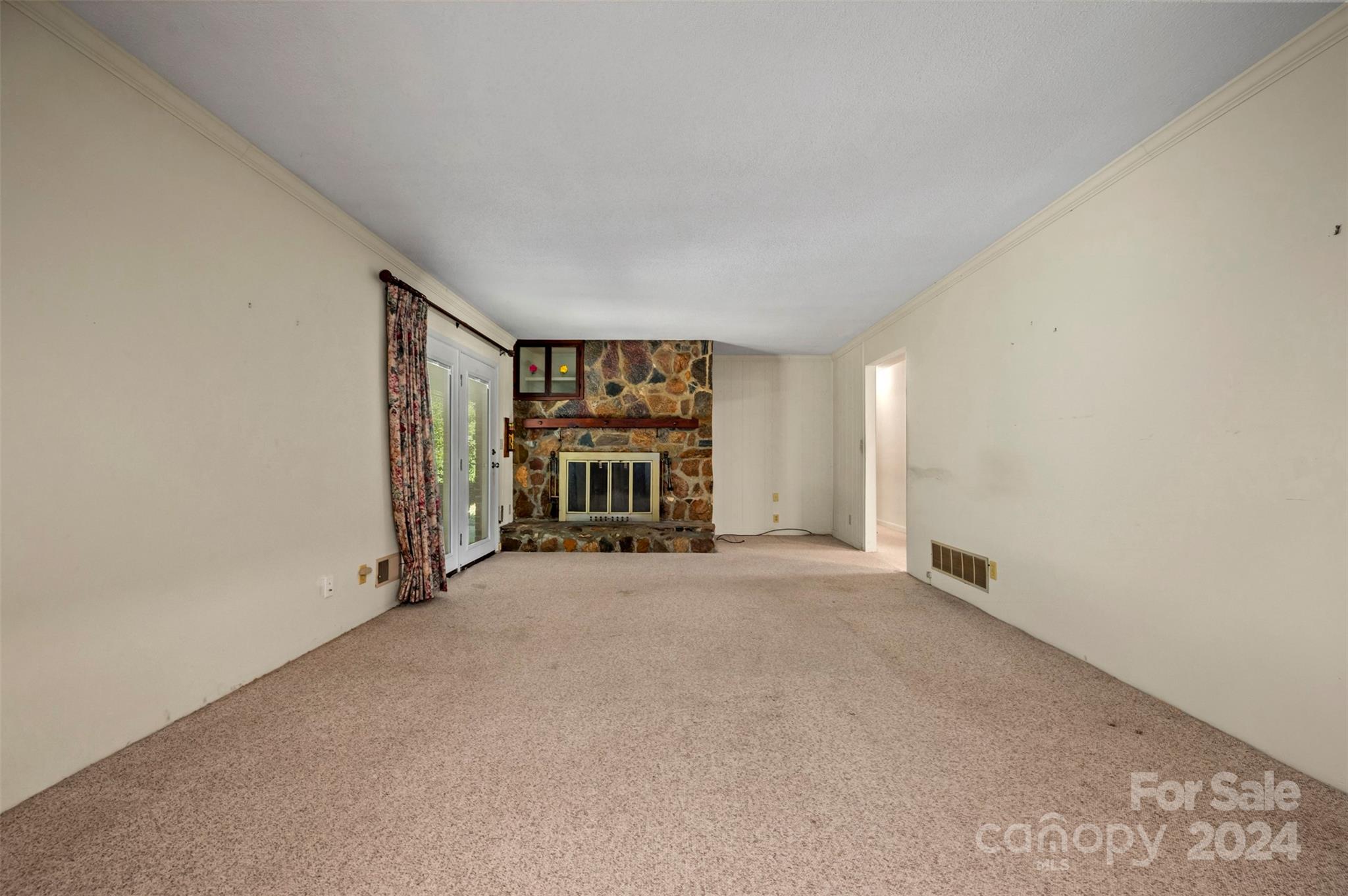 280 Dug Hill Road Landrum, SC 29356 - Photo 8 of 45 an empty room with fireplace and windows
