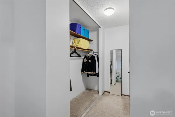 a room with a washing machine and a window
