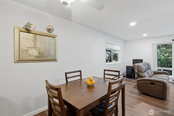 a view of a dining room with furniture and wooden floor