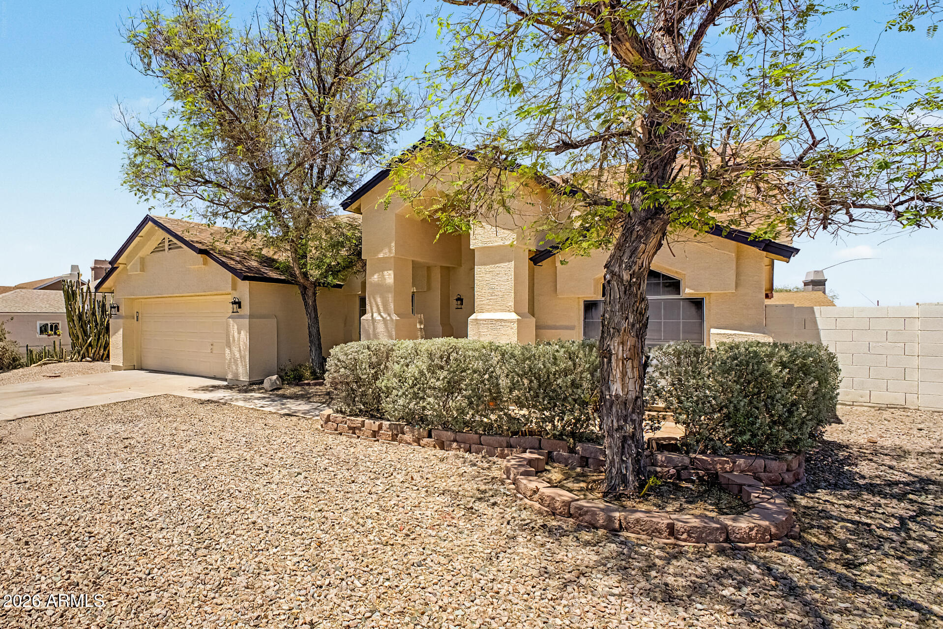 2762 North Ricardo Mesa, AZ 85215 - Photo 1 of 38 a front view of a house with a yard and garage