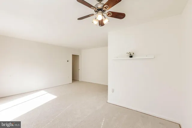 a view of empty room with floor to ceiling window