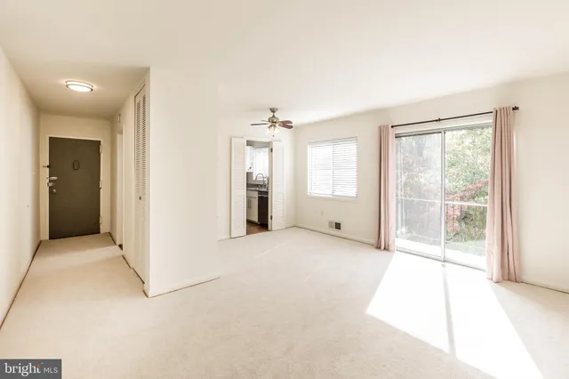 a view of an empty room with a window