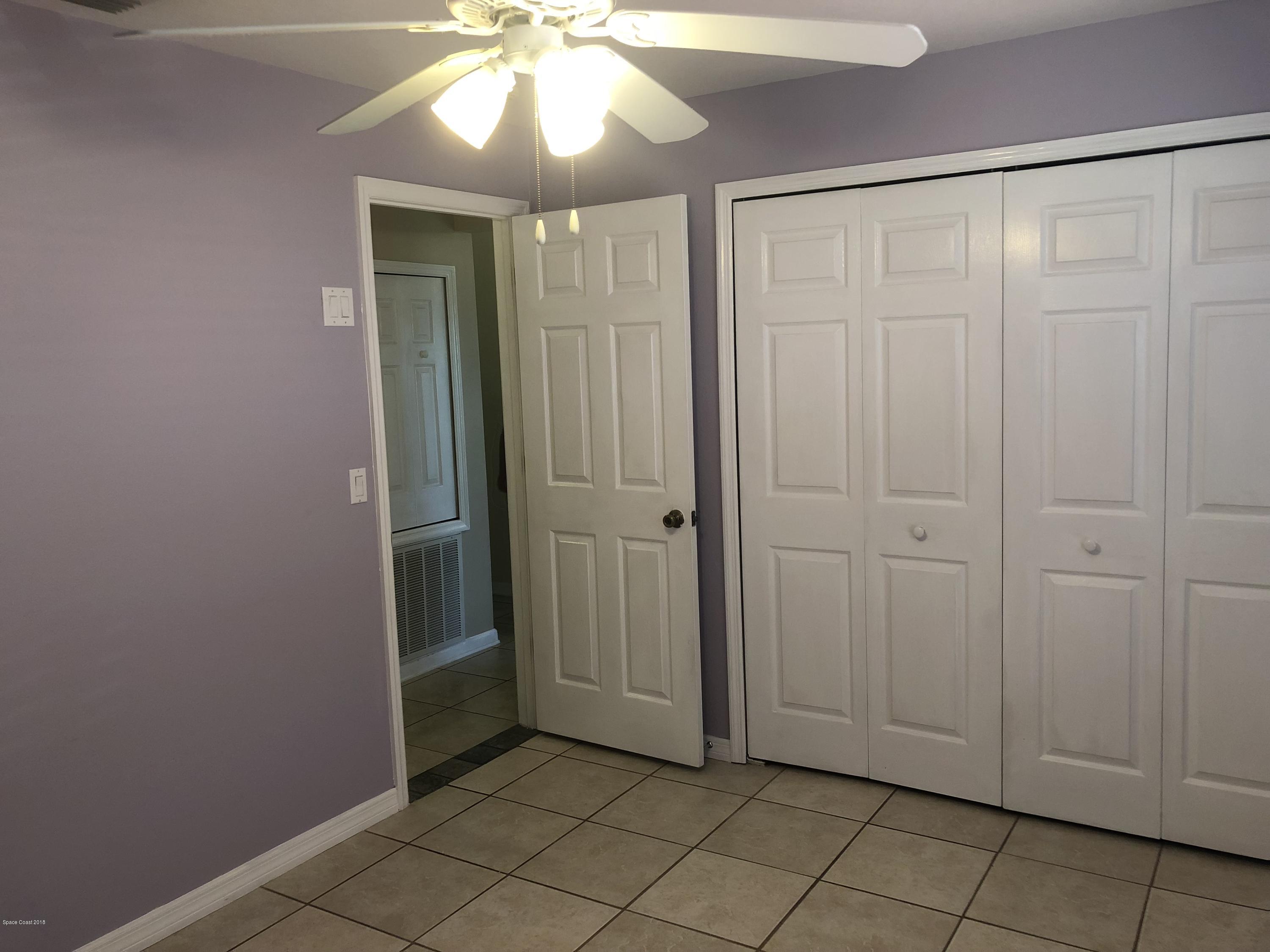 969 Ray Road Southeast Palm Bay, FL 32909 - Photo 11 of 22 an empty room with closet area