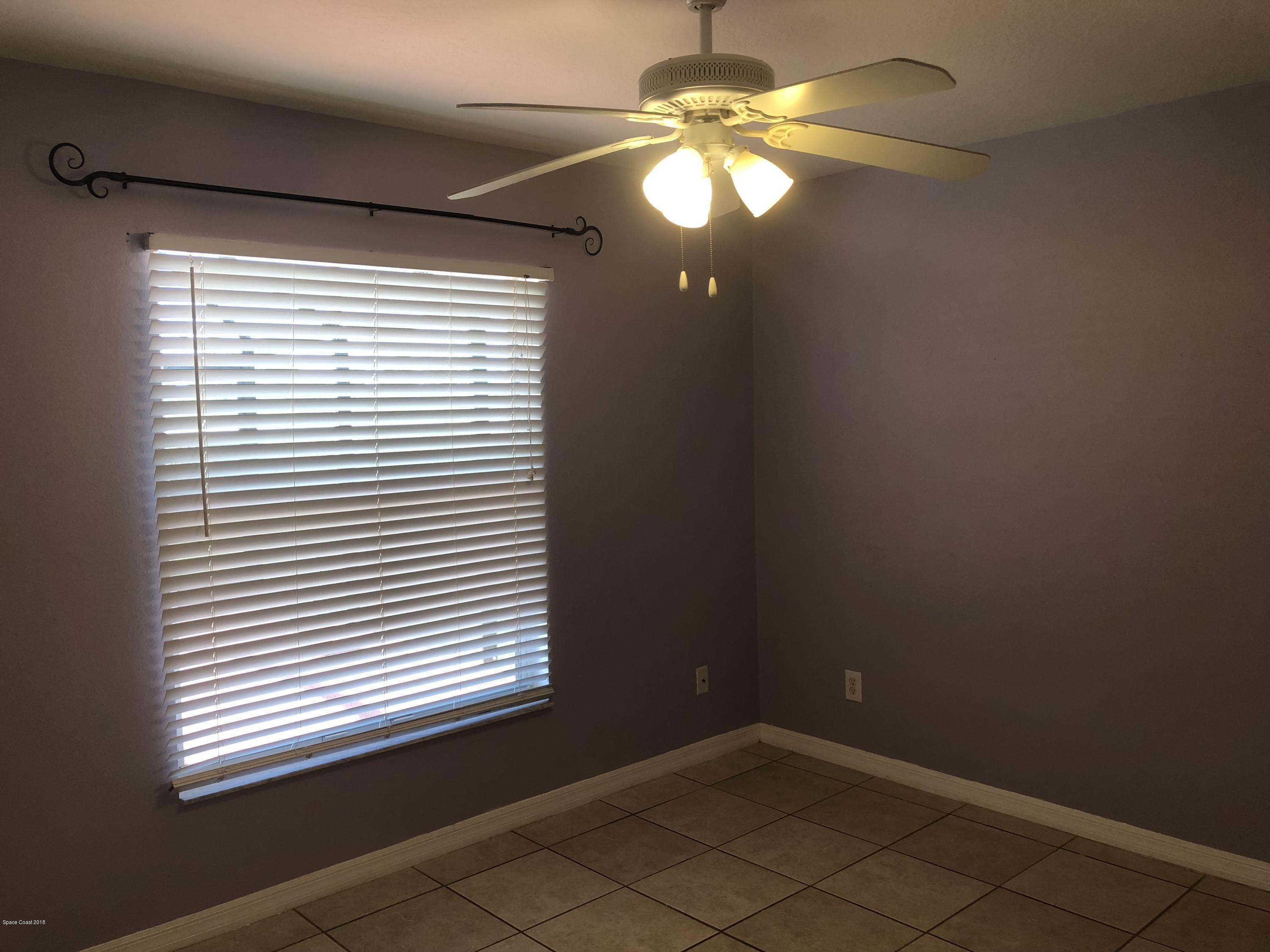 969 Ray Road Southeast Palm Bay, FL 32909 - Photo 12 of 22 a view of a livingroom with a window