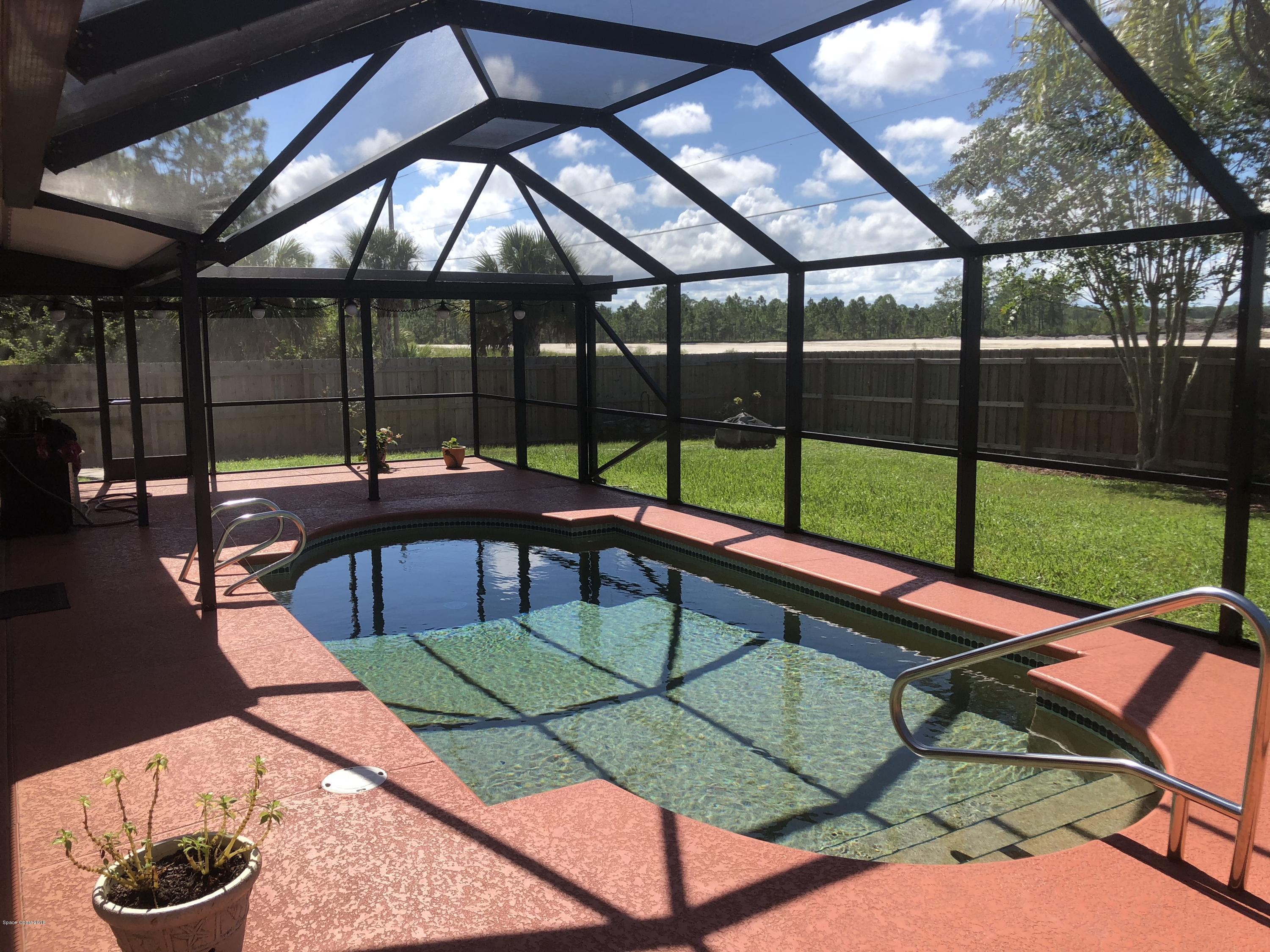 969 Ray Road Southeast Palm Bay, FL 32909 - Photo 13 of 22 a view of swimming pool with seating area and furniture