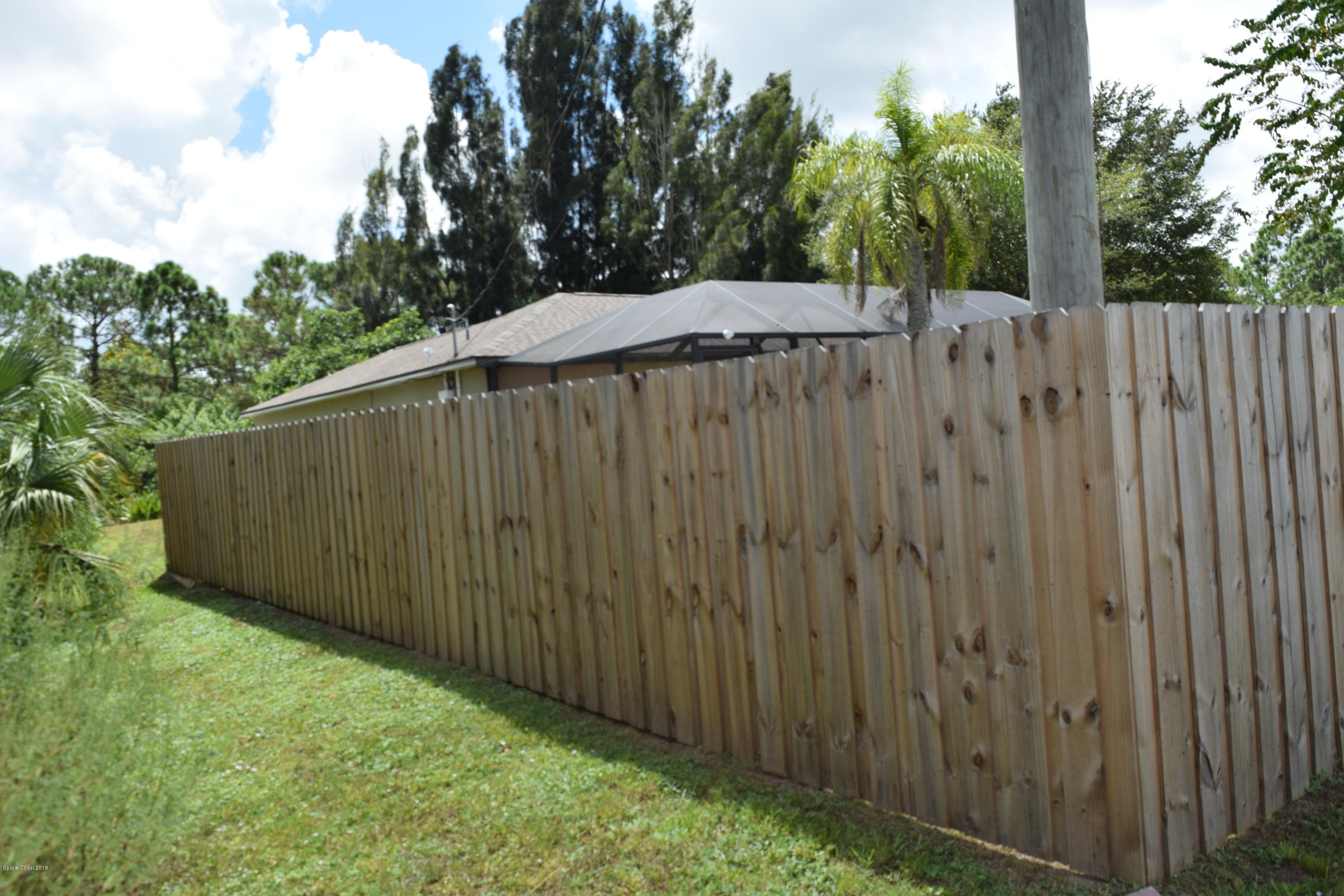 969 Ray Road Southeast Palm Bay, FL 32909 - Photo 22 of 22 a backyard of a house