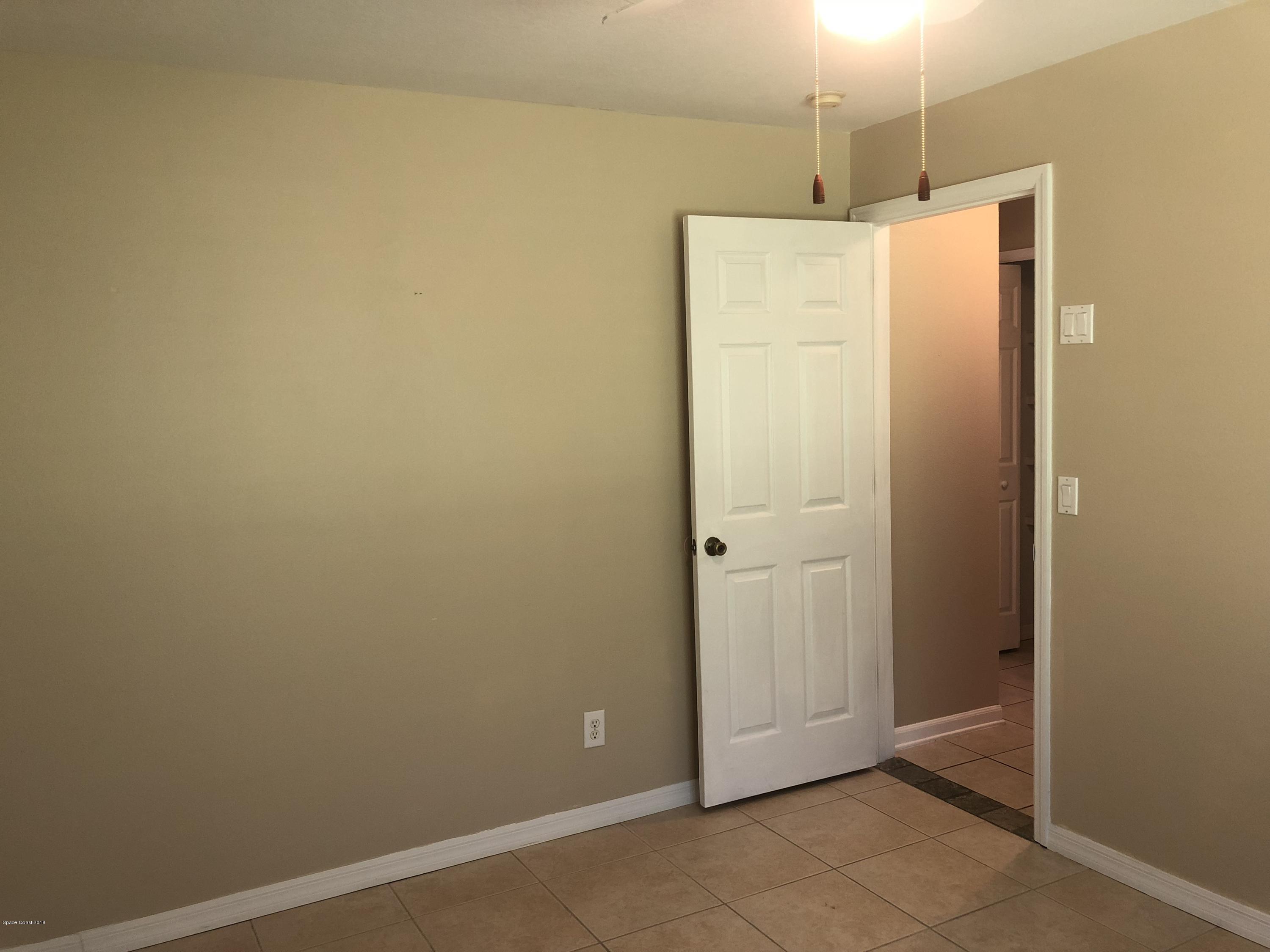 969 Ray Road Southeast Palm Bay, FL 32909 - Photo 6 of 22 a bathroom with a shower and a sink