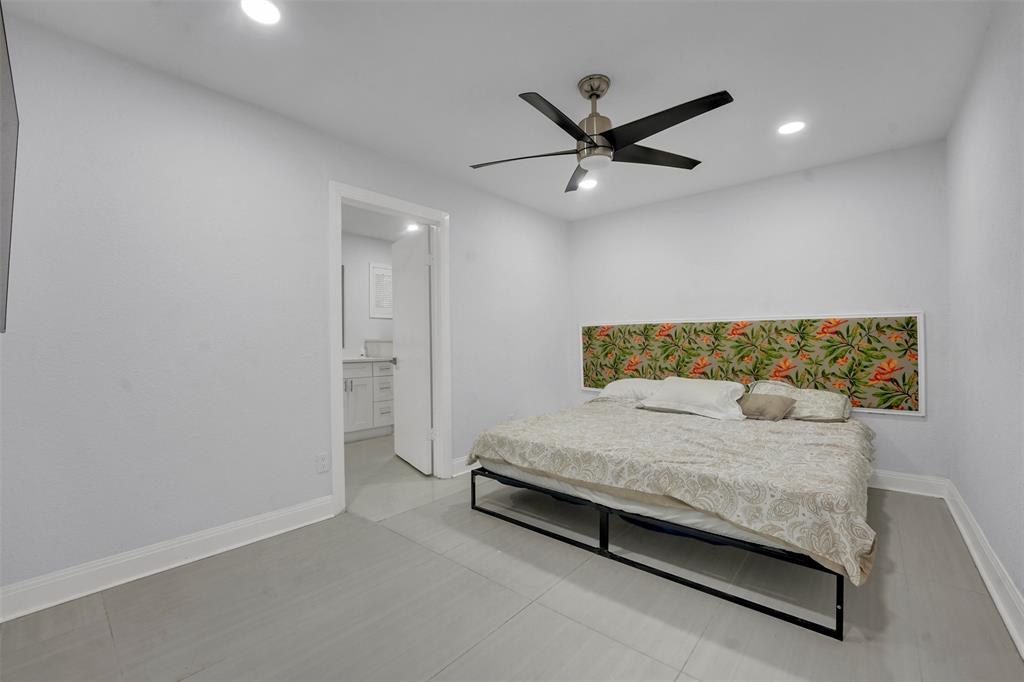 10525 Post Oak Bend Lane Wills Point, TX 75169 - Photo 11 of 40 Bedroom with light tile patterned floors, ensuite bathroom, recessed lighting, and a ceiling fan