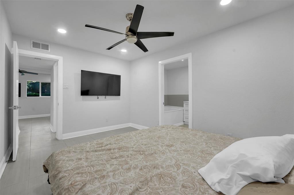 10525 Post Oak Bend Lane Wills Point, TX 75169 - Photo 12 of 40 Bedroom with recessed lighting, a ceiling fan, ensuite bathroom, and light tile patterned floors