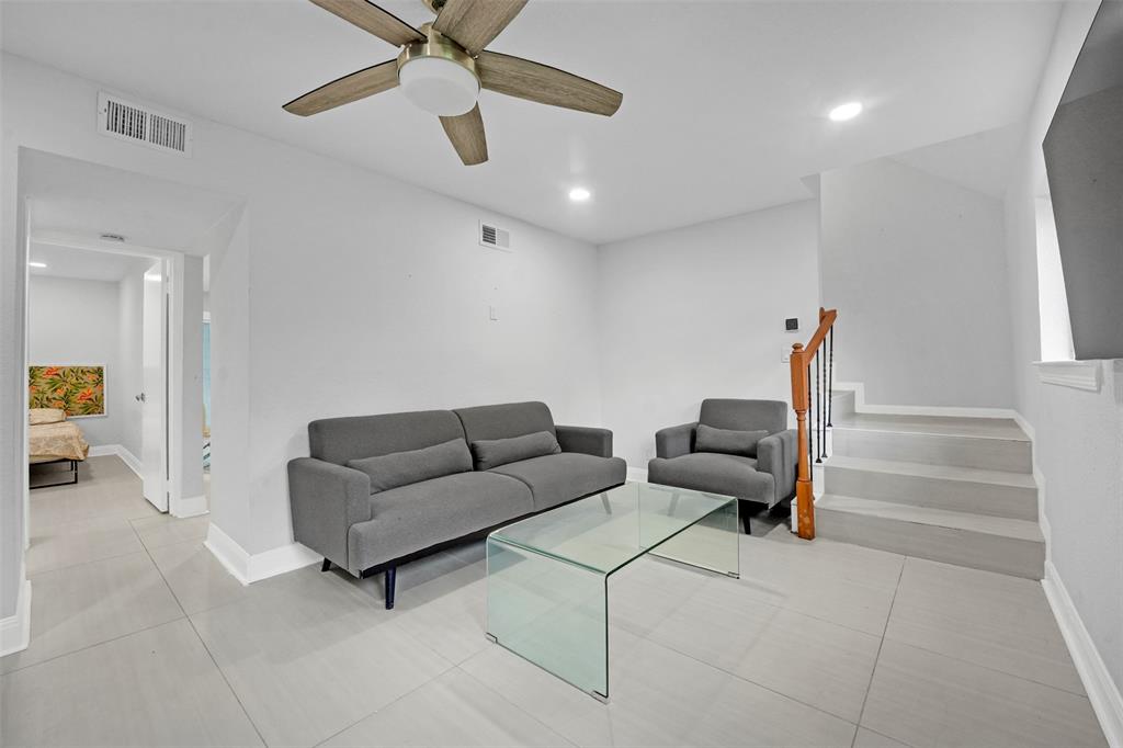 10525 Post Oak Bend Lane Wills Point, TX 75169 - Photo 17 of 40 Living area with light tile patterned floors, stairs, recessed lighting, and a ceiling fan