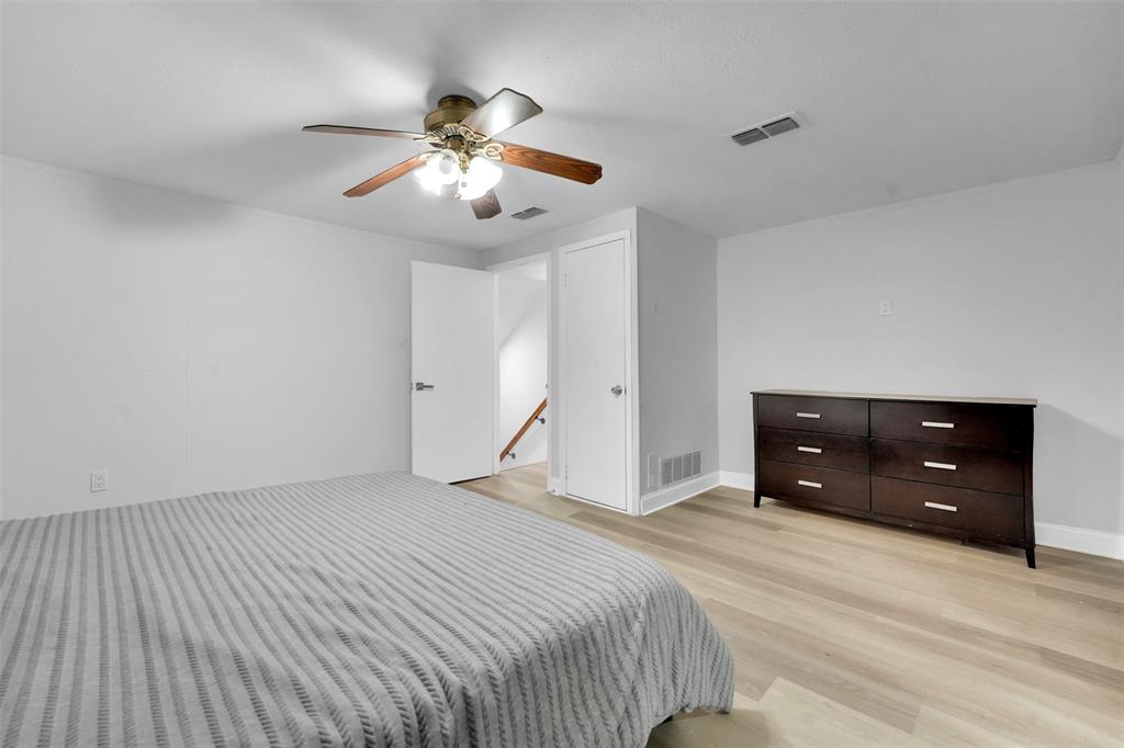 10525 Post Oak Bend Lane Wills Point, TX 75169 - Photo 20 of 40 Bedroom featuring light wood-style flooring and a ceiling fan
