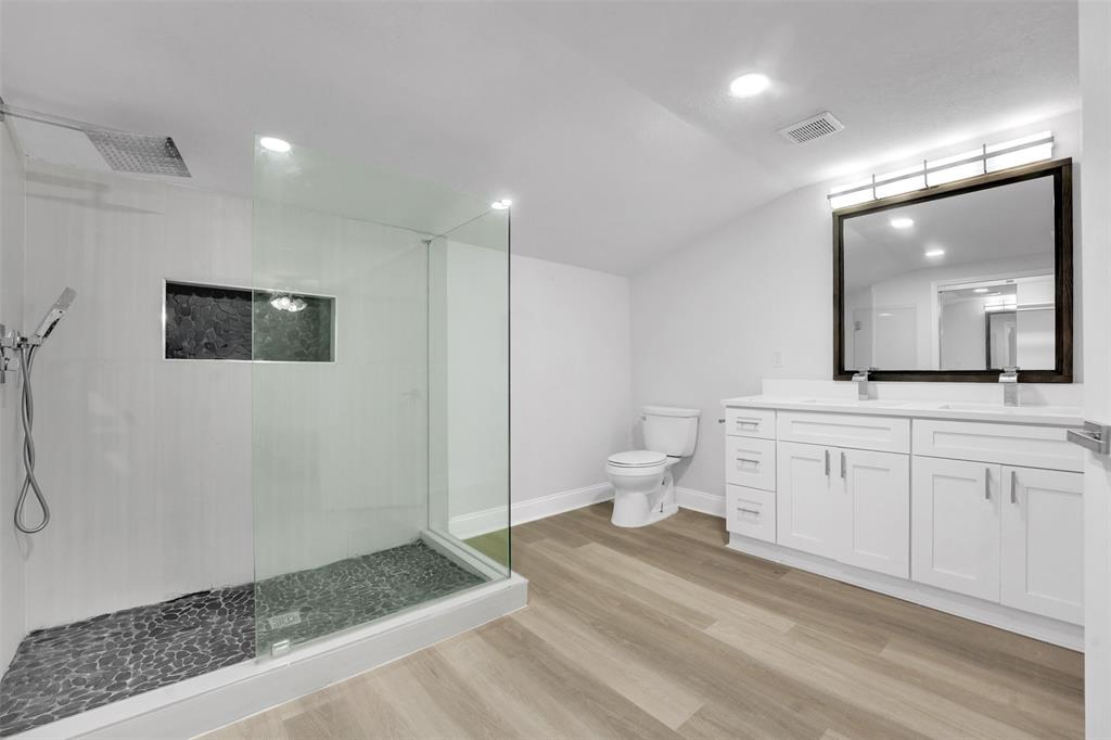 10525 Post Oak Bend Lane Wills Point, TX 75169 - Photo 21 of 40 Full bath featuring a walk in shower, vanity, vaulted ceiling, light wood-style flooring, and recessed lighting