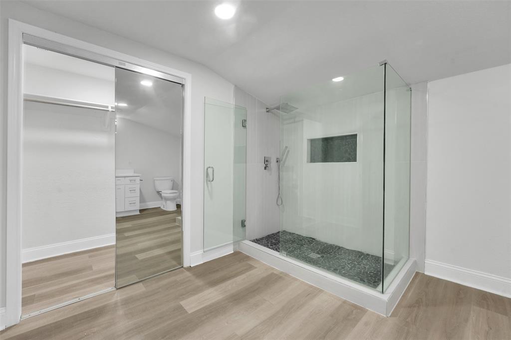 10525 Post Oak Bend Lane Wills Point, TX 75169 - Photo 22 of 40 Full bathroom featuring a stall shower, light wood finished floors, vaulted ceiling, vanity, and recessed lighting