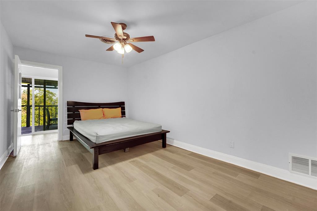 10525 Post Oak Bend Lane Wills Point, TX 75169 - Photo 23 of 40 Bedroom featuring light wood finished floors, ceiling fan, and access to outside
