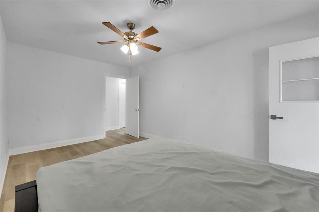 10525 Post Oak Bend Lane Wills Point, TX 75169 - Photo 24 of 40 Bedroom with light wood-style floors and a ceiling fan