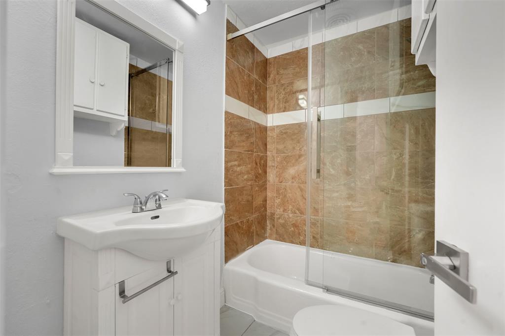 10525 Post Oak Bend Lane Wills Point, TX 75169 - Photo 25 of 40 Bathroom featuring enclosed tub / shower combo and vanity