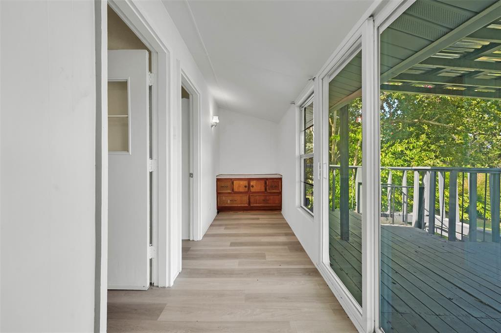 10525 Post Oak Bend Lane Wills Point, TX 75169 - Photo 29 of 40 Hallway with light wood-style flooring and lofted ceiling