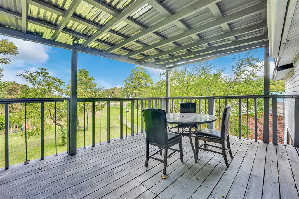 10525 Post Oak Bend Lane Wills Point, TX 75169 - Photo 30 of 40 Wooden deck featuring outdoor dining area and view of scattered trees