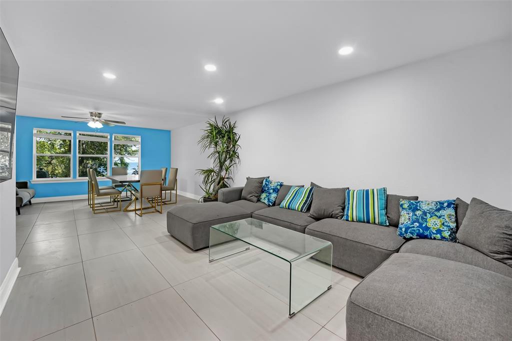 10525 Post Oak Bend Lane Wills Point, TX 75169 - Photo 3 of 40 Living area with recessed lighting, light tile patterned flooring, and ceiling fan